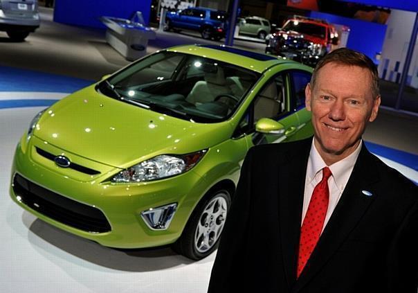 Ford Motor Company, president and CEO, Alan Mulally standing next to a 2011 Fiesta on display at the Washington DC Auto Show.